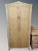 A birds-eye maple veneered dome topped double door wardrobe,