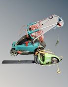 A Bosch electric garden mower together with a hedge trimmer