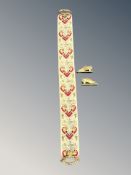 An Ecclesiastical tapestry pull chord with ornate ormolu handles together with two brass fireplace