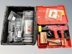 A Hilti nail gun in box and a further tool box containing wall sockets