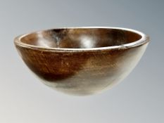 A large antique stained oak fruit or dough bowl,