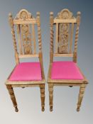 A pair of heavily carved oak barley twist dining chairs