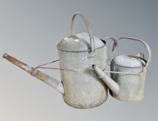 Two galvanised watering cans