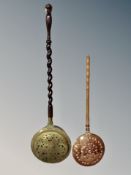 A 19th century brass bed pan and a copper example