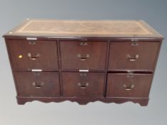 A reproduction mahogany six drawer office filing sideboard with brown tooled leather inset panel,