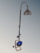 A contemporary standard lamp and a copper pipe table lamp with enamelled shade