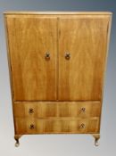 A walnut double door linen cabinet,