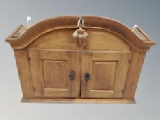 A 19th century oak dome topped wall cabinet,