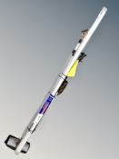 A bundle of household tools, brushes, spade, measuring rule,