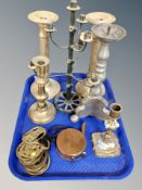 A tray of brass candlesticks, horse brasses, miniature copper watering can,
