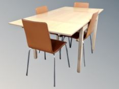 A contemporary pine effect extending dining table,