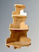 A pine three tier corner shelf