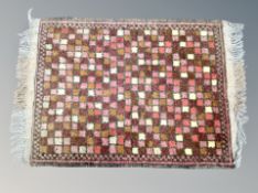 A small Iranian hearth rug 66 cm x 44 cm