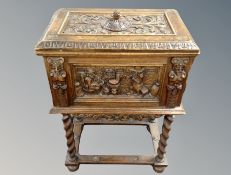 A 19th century Danish oak storage box with lid on stand,