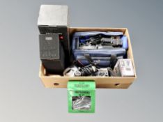 A box of Sharp video camera in bag, Sony Cybershot camera, pair of headphones,