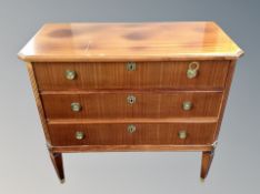 A Danish teak chest of three drawers,