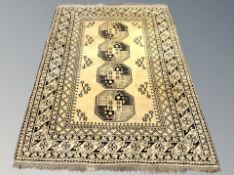 An Afghan Bokhara rug on gold ground,