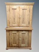 A 19th century double door pine cabinet on stand,