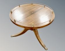 A reproduction mahogany tripod occasional table with gallery top,