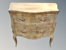 A 19th century Continental walnut and satinwood inlaid serpentine fronted chest,