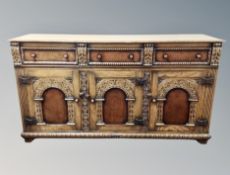 A good quality oak and burr walnut sideboard, probably by Titchmarsh and Goodwin,
