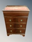 A reproduction mahogany writing bureau with lift up tooled leather inset top,