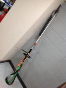 A Florabest electric pole hedge trimmer