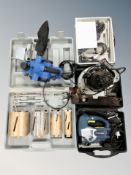 A group of power tools, sander, dremel,