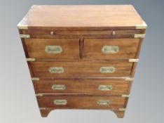 A mahogany and brass mounted campagin style low chest with brass drop handles,