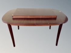 A Danish teak extending dining table with two leaves, total length 260 cm,