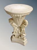 A concrete classical style pedestal,