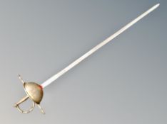 An ornamental Spanish sword with hand guard and three Indian swords