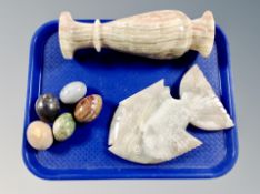 A carved and polished alabaster fish,