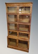 A Globe Wernicke style oak five height glazed stacking bookcase,