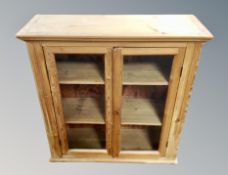 A 19th century glazed pine bookcase,