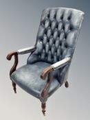 A William IV style Chesterfield library armchair in deep buttoned and studded blue leather