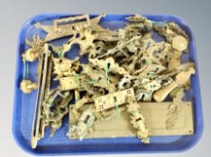 A collection of antique brass door furinture, escutcheons,