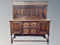 An Edwardian oak barley twist sideboard,