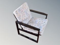 A Danish ebonised armchair