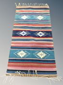 An Eastern flat weave kilim 170 cm x 78 cm