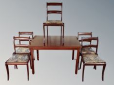 A Danish stained teak extending dining table together with a set of five dining chairs in William