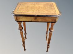 A 19th century Danish figured walnut and ebonised work table, with compartmentalised interior,