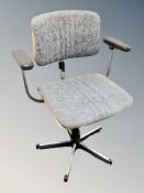 A teak and chrome office armchair in grey upholstery