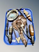 A polished mother of pearl shell bowl together with a quantity of pipes,