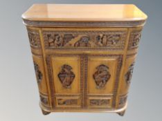A heavily carved Chinese drinks cabinet,