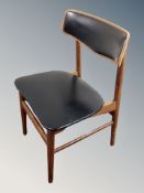 A 20th century Danish teak black vinyl dining chair