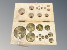 A precision set of precision brass weights in fitted pine box,