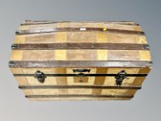 An early 20th century dome topped shipping trunk,