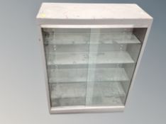 An enamel metal sliding glass door cabinet,