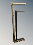 A Victorian brass extending fire curb and a further steel example